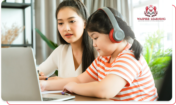 Mother helping young daughter with headphones use a laptop for Vassfire Learning.